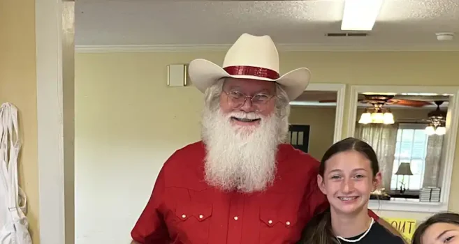 Cowboy Santa baking treats with the kids